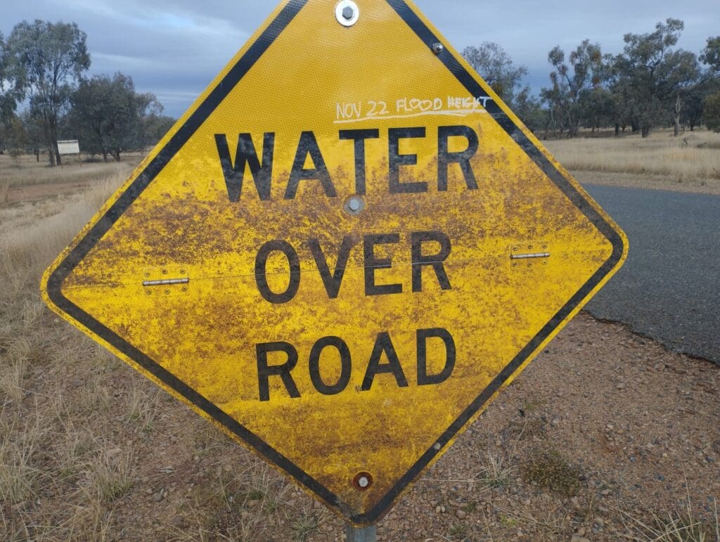 Road sign water over road