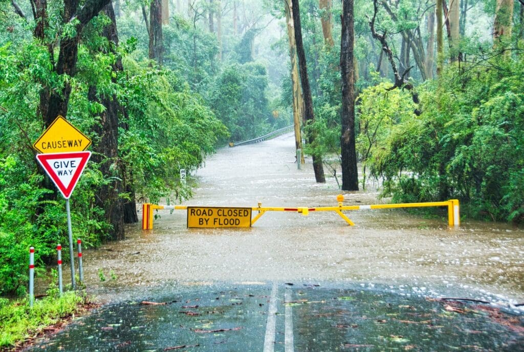 Road closed by flood sign