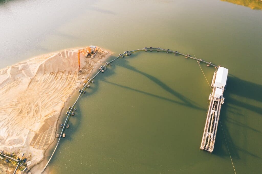 Channel dredging with sediment containment